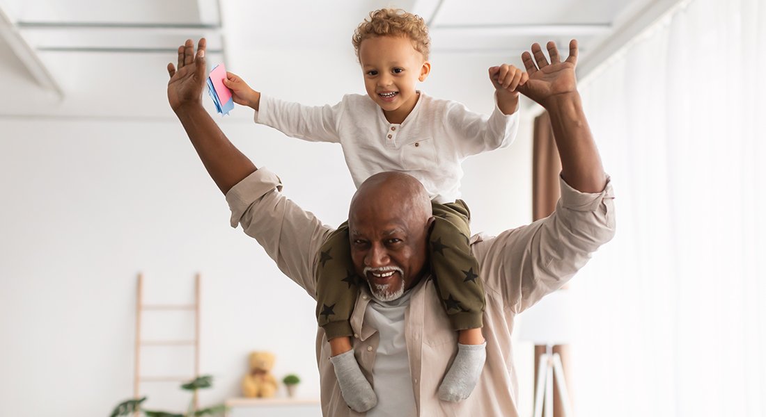Grandfather with child on his shoulders